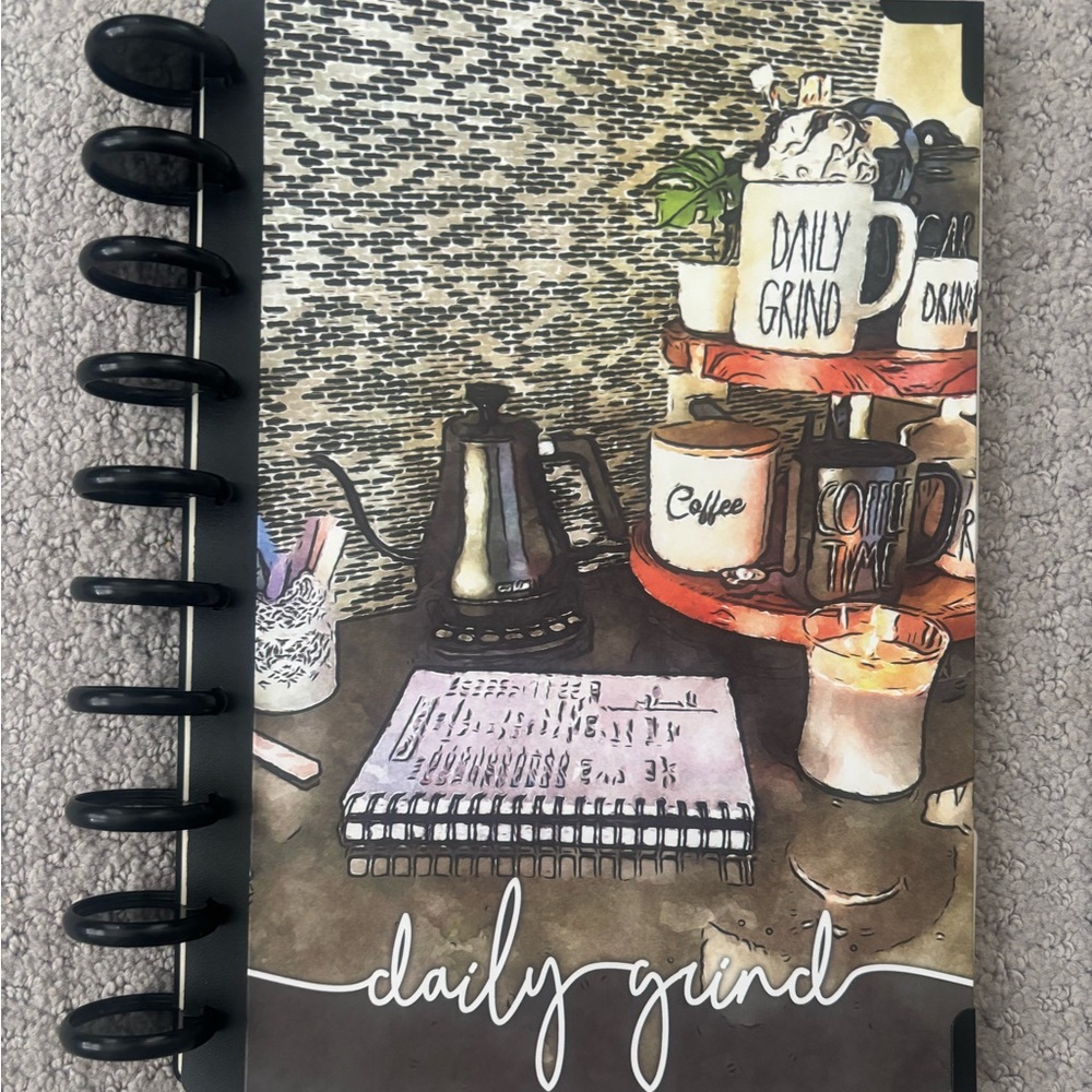 Daily Grind Planner cover, discs, champagne luxe inserts, and unused stickers.